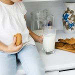 little-hands-holding-cookie-glass-milk